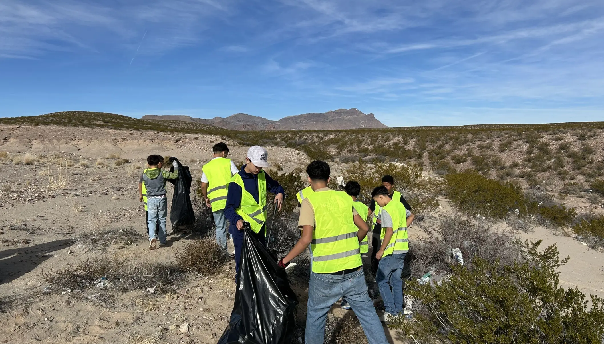 Students working together to clean up